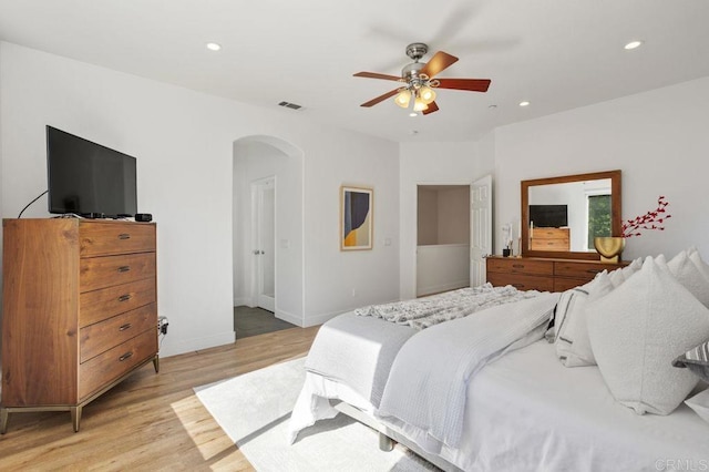 16863 Abundante St, San Diego, CA 92127 - bedroom with arched walkways, light wood finished floors, recessed lighting, a ceiling fan, and baseboards