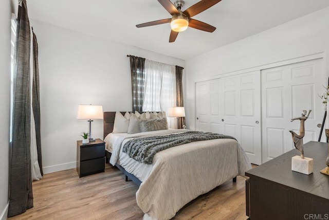 16863 Abundante St, San Diego, CA 92127 - bedroom with a closet, light wood-style flooring, baseboards, and a ceiling fan