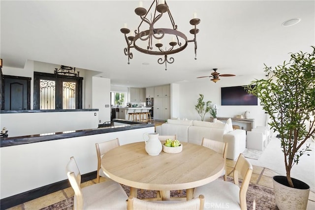 2585 Barcelona, Pismo Beach, CA 93449 - dining room featuring ceiling fan and a chandelier