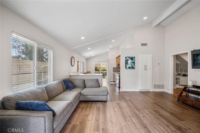 26882 Ayamonte, Mission Viejo, CA 92692 - living area with light wood-type flooring, recessed lighting, high vaulted ceiling, beamed ceiling, and baseboards