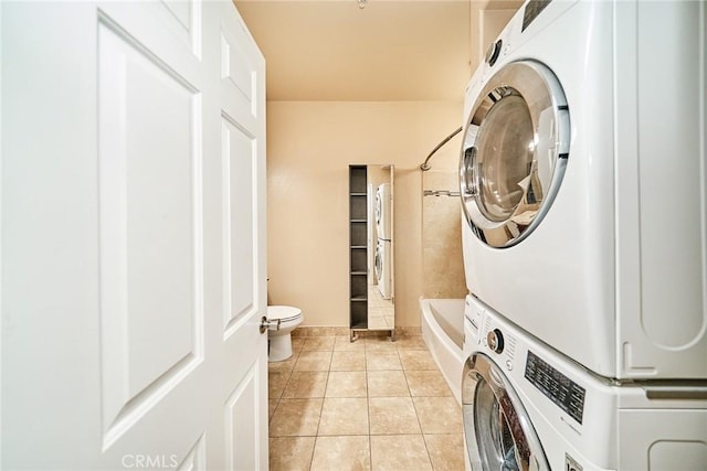 300 E Providencia Ave Unit 211, Burbank, CA 91502 - washroom with stacked washing machine and dryer and light tile patterned floors