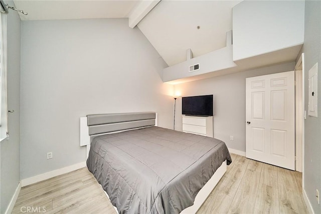 300 E Providencia Ave Unit 211, Burbank, CA 91502 - bedroom with wood finished floors, beamed ceiling, baseboards, and high vaulted ceiling