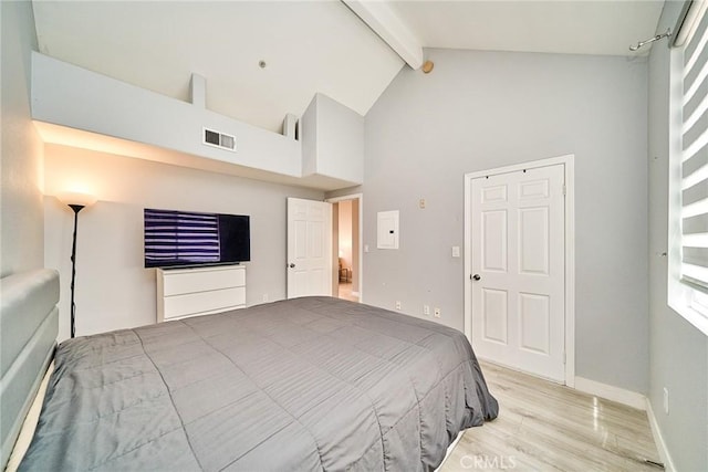 300 E Providencia Ave Unit 211, Burbank, CA 91502 - bedroom with beam ceiling, high vaulted ceiling, light wood-style flooring, and baseboards