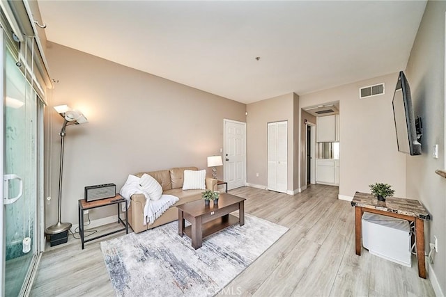 300 E Providencia Ave Unit 211, Burbank, CA 91502 - living area featuring light wood-type flooring and baseboards