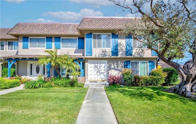 4394 Dina Ct, Cypress, CA 90630 - view of front facade featuring stucco siding, a shingled roof, and a front yard