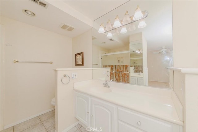 4394 Dina Ct, Cypress, CA 90630 - bathroom featuring vanity, toilet, tile patterned floors, a stall shower, and baseboards