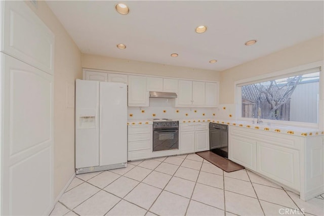 4394 Dina Ct, Cypress, CA 90630 - kitchen with black appliances, under cabinet range hood, white cabinetry, light countertops, and recessed lighting