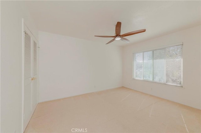 4394 Dina Ct, Cypress, CA 90630 - unfurnished bedroom featuring light carpet, a closet, and ceiling fan