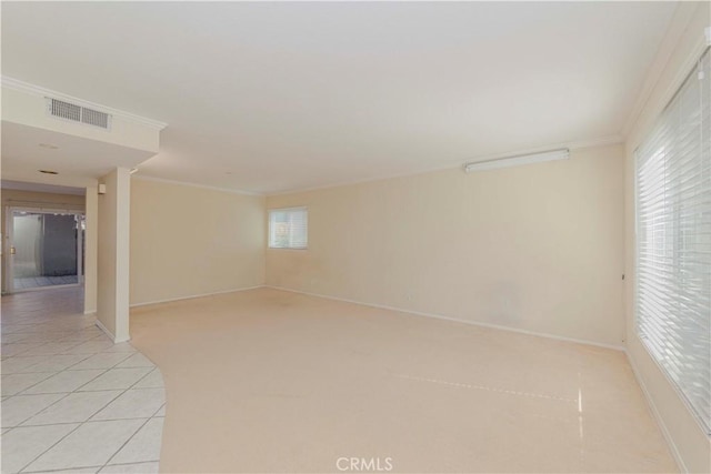 4394 Dina Ct, Cypress, CA 90630 - spare room featuring crown molding, baseboards, and light tile patterned floors