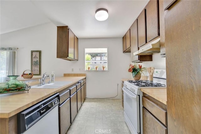 30124 Casa Chata Pl, Temecula, CA 92592 - kitchen with white appliances, under cabinet range hood, a sink, a peninsula, and butcher block countertops