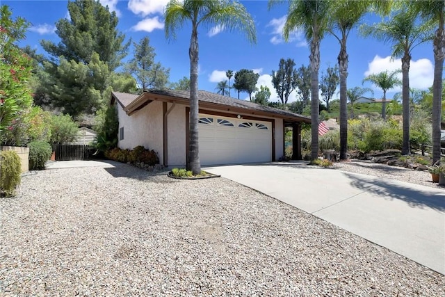 30124 Casa Chata Pl, Temecula, CA 92592 - view of front facade featuring stucco siding, an attached garage, and driveway