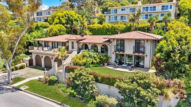 364 Via Almar, Palos Verdes Estates, CA 90274 - mediterranean / spanish home featuring a balcony, stucco siding, a tile roof, and driveway