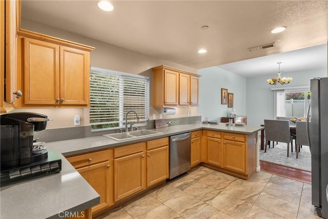 15721 Cobalt St Unit 118, Sylmar, CA 91342 - kitchen with stainless steel appliances, a peninsula, a chandelier, recessed lighting, and decorative light fixtures