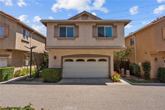 15721 Cobalt St Unit 118, Sylmar, CA 91342 - traditional home with a garage, stucco siding, and concrete driveway