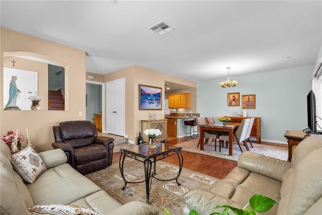 15721 Cobalt St Unit 118, Sylmar, CA 91342 - living area with a chandelier and light wood-style floors