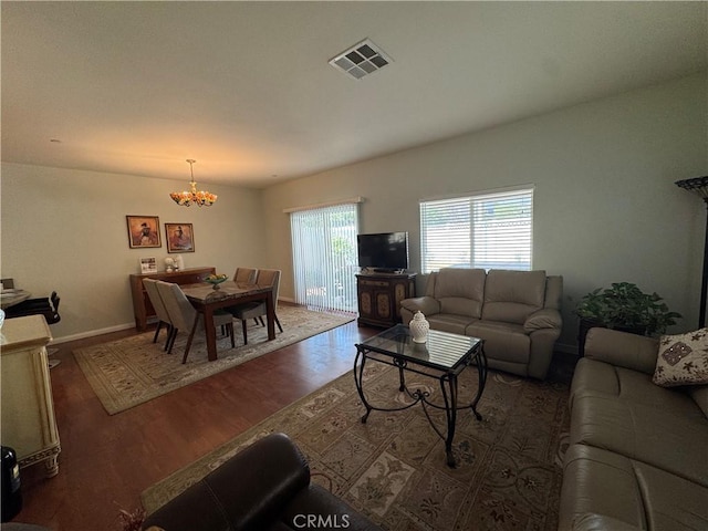 15721 Cobalt St Unit 118, Sylmar, CA 91342 - living room featuring a chandelier and wood finished floors