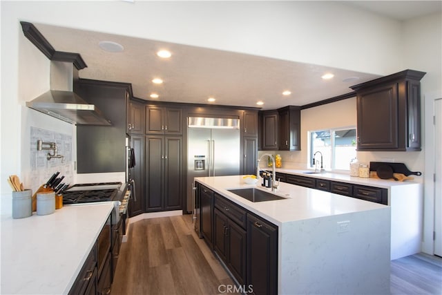 4374 Mahogany Cir, Yorba Linda, CA 92886 - kitchen with a sink, recessed lighting, dark wood finished floors, a kitchen island with sink, and built in refrigerator