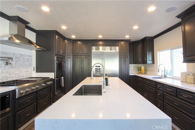 4374 Mahogany Cir, Yorba Linda, CA 92886 - kitchen with a sink, built in appliances, wall chimney range hood, an island with sink, and recessed lighting