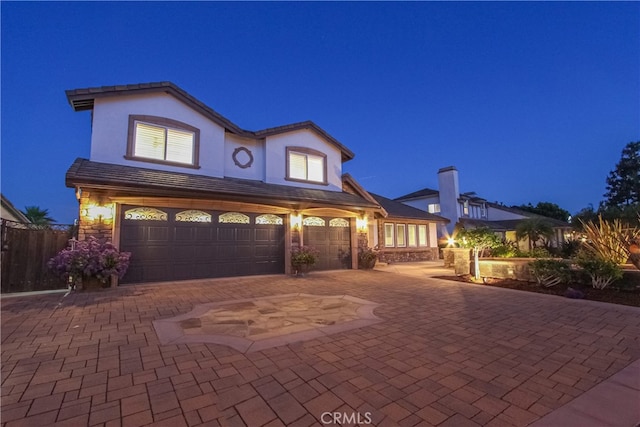 4374 Mahogany Cir, Yorba Linda, CA 92886 - view of front of property featuring an attached garage, decorative driveway, and stucco siding