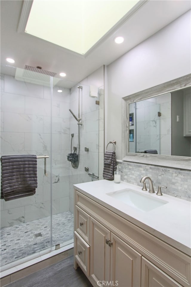 4374 Mahogany Cir, Yorba Linda, CA 92886 - full bathroom with a marble finish shower, vanity, recessed lighting, backsplash, and wood finished floors
