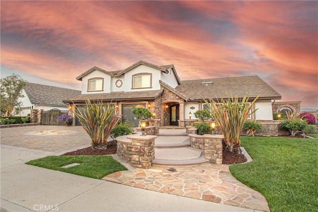 4374 Mahogany Cir, Yorba Linda, CA 92886 - view of front of home with stucco siding, stone siding, and decorative driveway