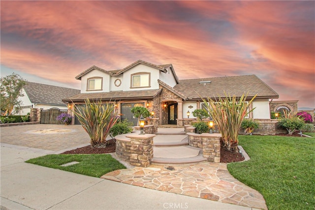 4374 Mahogany Cir, Yorba Linda, CA 92886 - view of front of home with stucco siding, stone siding, and decorative driveway