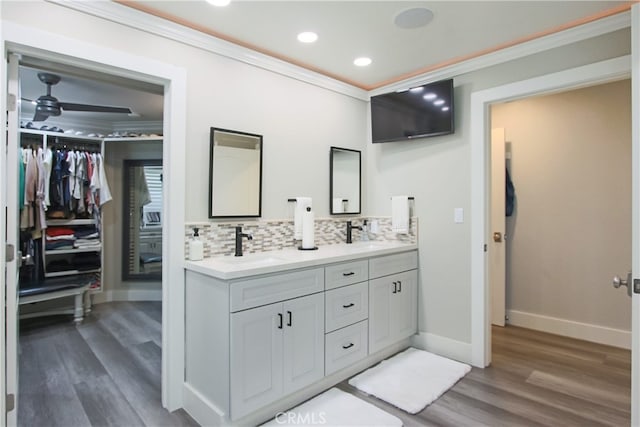 4374 Mahogany Cir, Yorba Linda, CA 92886 - full bathroom with ornamental molding, wood finished floors, double vanity, tasteful backsplash, and recessed lighting