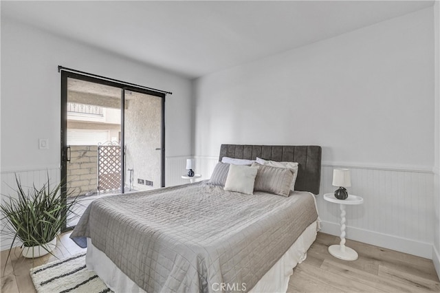 2633 Monte Carlo Unit 41, Santa Ana, CA 92706 - bedroom featuring a wainscoted wall and wood finished floors