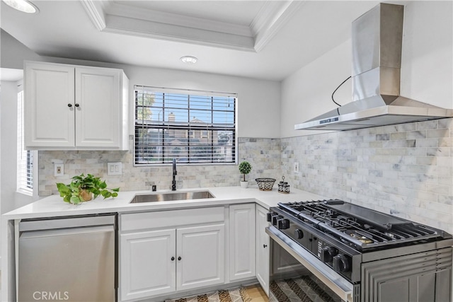 2633 Monte Carlo Unit 41, Santa Ana, CA 92706 - kitchen with exhaust hood, appliances with stainless steel finishes, a sink, white cabinetry, and ornamental molding