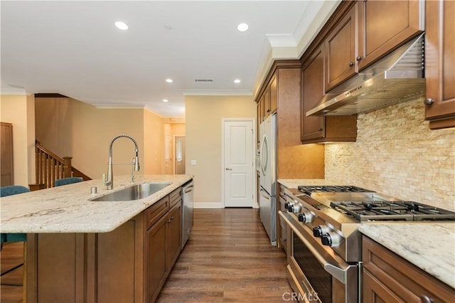 43 Lupari, Irvine, CA 92618 - kitchen with appliances with stainless steel finishes, a sink, under cabinet range hood, a kitchen island with sink, and ornamental molding