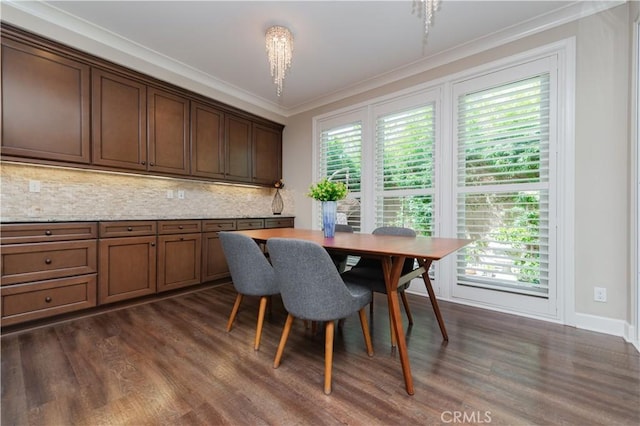 43 Lupari, Irvine, CA 92618 - dining space featuring ornamental molding, healthy amount of natural light, dark wood-style flooring, and baseboards