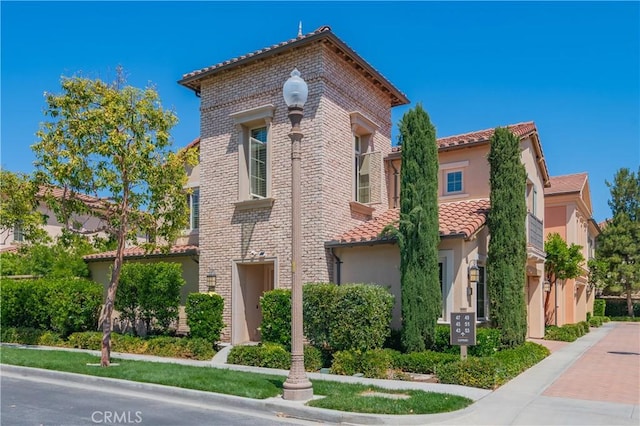43 Lupari, Irvine, CA 92618 - view of front of property with a tile roof and stucco siding