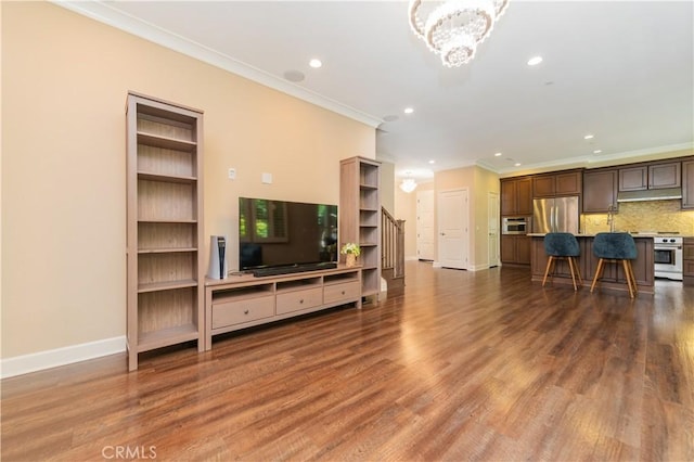 43 Lupari, Irvine, CA 92618 - living area with crown molding, recessed lighting, baseboards, wood finished floors, and a chandelier
