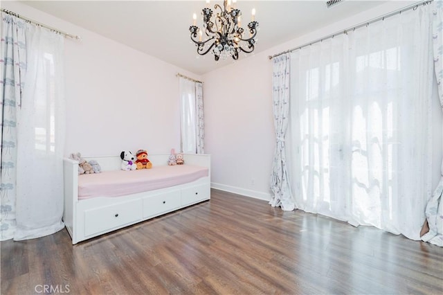 43 Lupari, Irvine, CA 92618 - bedroom with wood finished floors, a chandelier, and baseboards