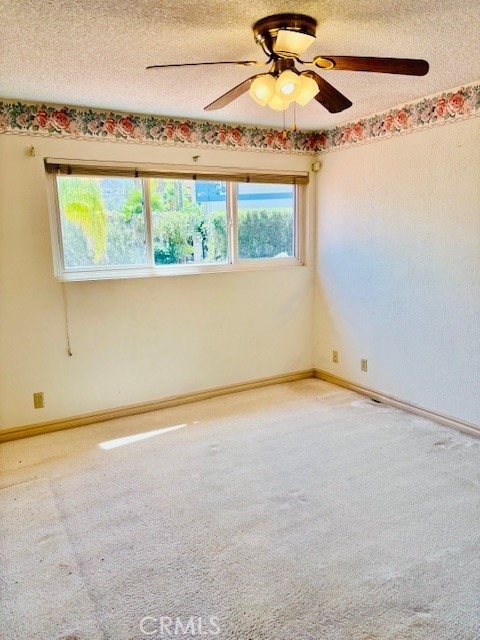 30417 Golden Gate Dr, Canyon Lake, CA 92587 - carpeted empty room with ceiling fan and a textured ceiling