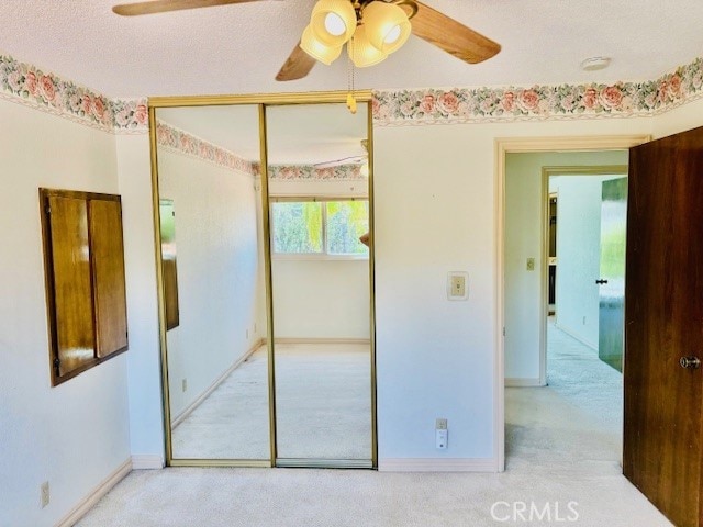 30417 Golden Gate Dr, Canyon Lake, CA 92587 - unfurnished bedroom with carpet flooring, a closet, and ceiling fan