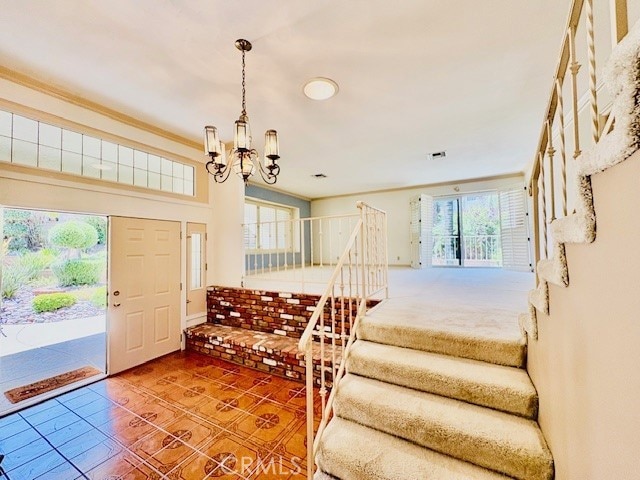 30417 Golden Gate Dr, Canyon Lake, CA 92587 - entrance foyer featuring a chandelier, tile patterned flooring, and stairway