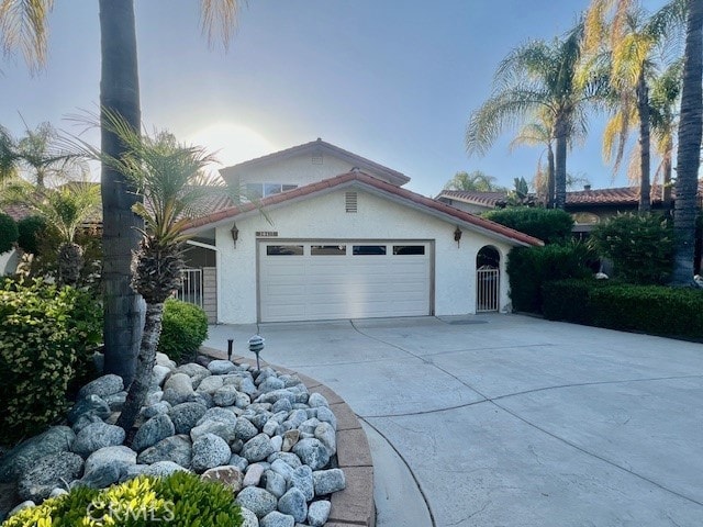 30417 Golden Gate Dr, Canyon Lake, CA 92587 - view of side of home with stucco siding, driveway, and an attached garage