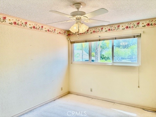 30417 Golden Gate Dr, Canyon Lake, CA 92587 - spare room featuring a ceiling fan, light colored carpet, and a textured ceiling