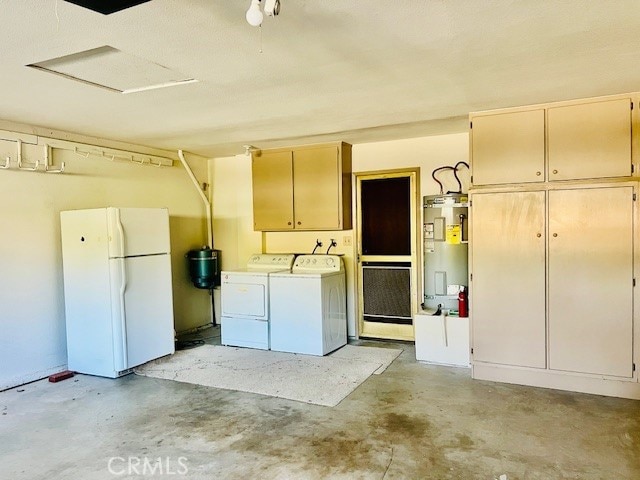 30417 Golden Gate Dr, Canyon Lake, CA 92587 - garage featuring freestanding refrigerator, water heater, and independent washer and dryer