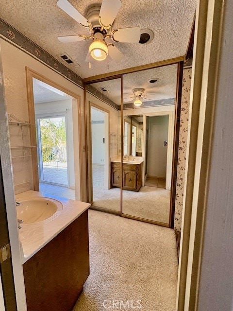 30417 Golden Gate Dr, Canyon Lake, CA 92587 - bathroom featuring a textured ceiling, vanity, and ceiling fan