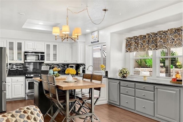 23985 Nicole Way, Yorba Linda, CA 92887 - kitchen with stainless steel appliances, a chandelier, backsplash, dark countertops, and recessed lighting
