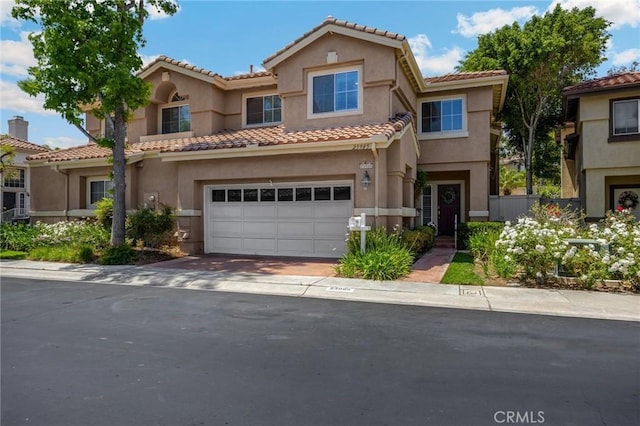 23985 Nicole Way, Yorba Linda, CA 92887 - view of front of home with stucco siding, an attached garage, and a tiled roof