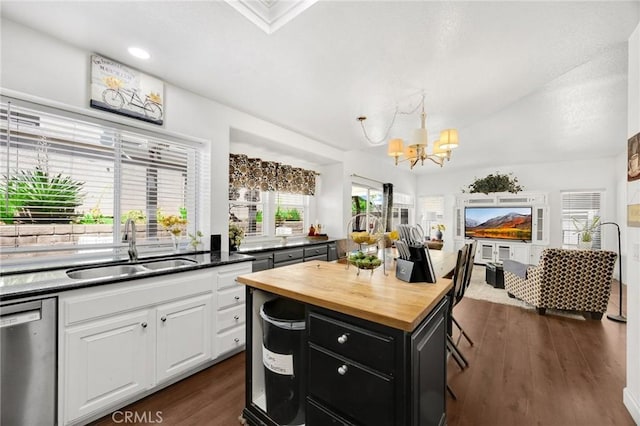 23985 Nicole Way, Yorba Linda, CA 92887 - kitchen with stainless steel dishwasher, a sink, butcher block counters, a chandelier, and white cabinets