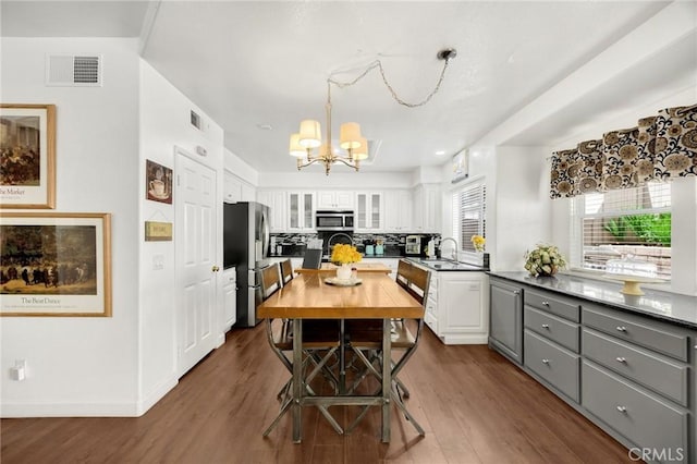 23985 Nicole Way, Yorba Linda, CA 92887 - kitchen with appliances with stainless steel finishes, a chandelier, a sink, gray cabinetry, and white cabinets