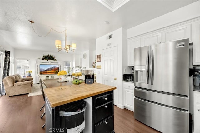 23985 Nicole Way, Yorba Linda, CA 92887 - kitchen with stainless steel fridge with ice dispenser, wood counters, a chandelier, and white cabinetry