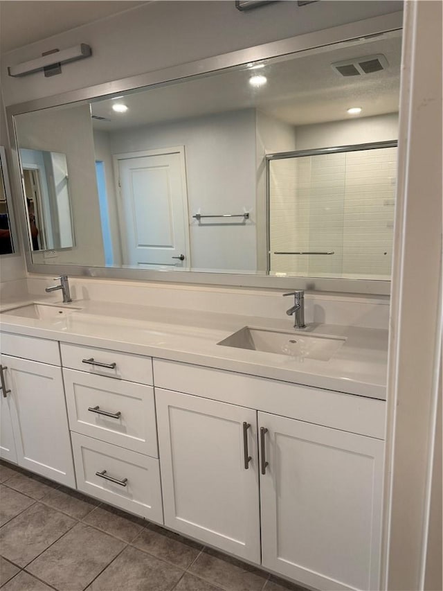 9360 Calm Water Pl, Rancho Cucamonga, CA 91730 - full bath featuring double vanity, tile patterned floors, and a shower stall