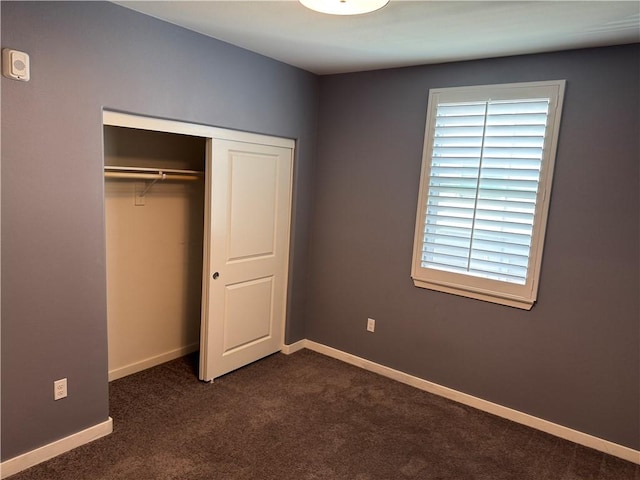 9360 Calm Water Pl, Rancho Cucamonga, CA 91730 - unfurnished bedroom featuring dark carpet, a closet, and baseboards