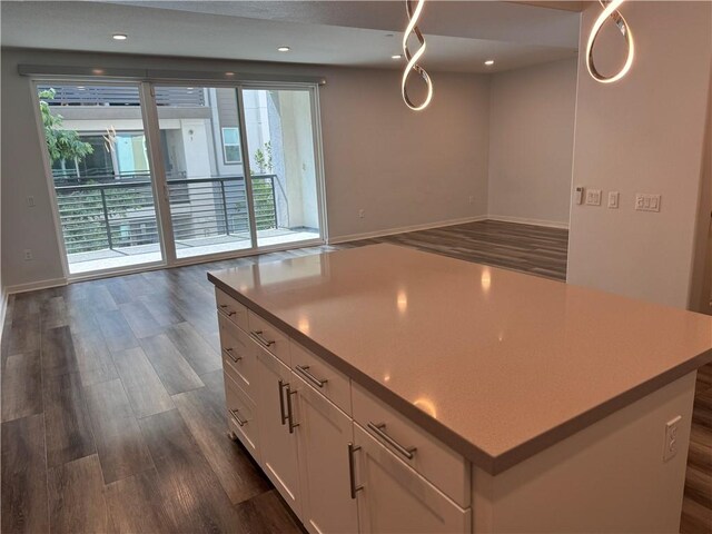 9360 Calm Water Pl, Rancho Cucamonga, CA 91730 - kitchen featuring open floor plan, dark wood finished floors, white cabinetry, recessed lighting, and light countertops