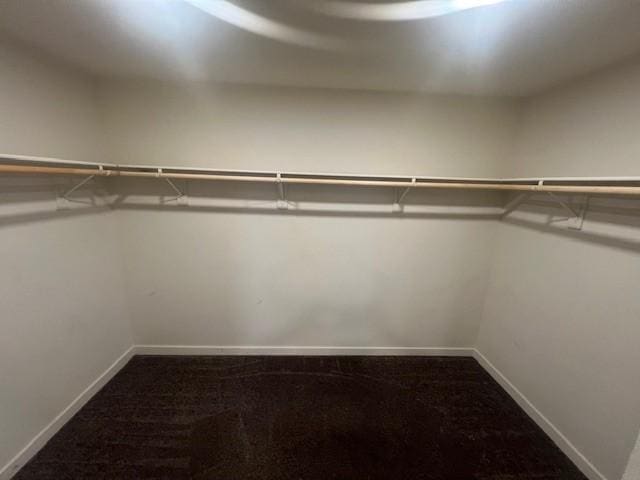 9360 Calm Water Pl, Rancho Cucamonga, CA 91730 - spacious closet featuring dark colored carpet